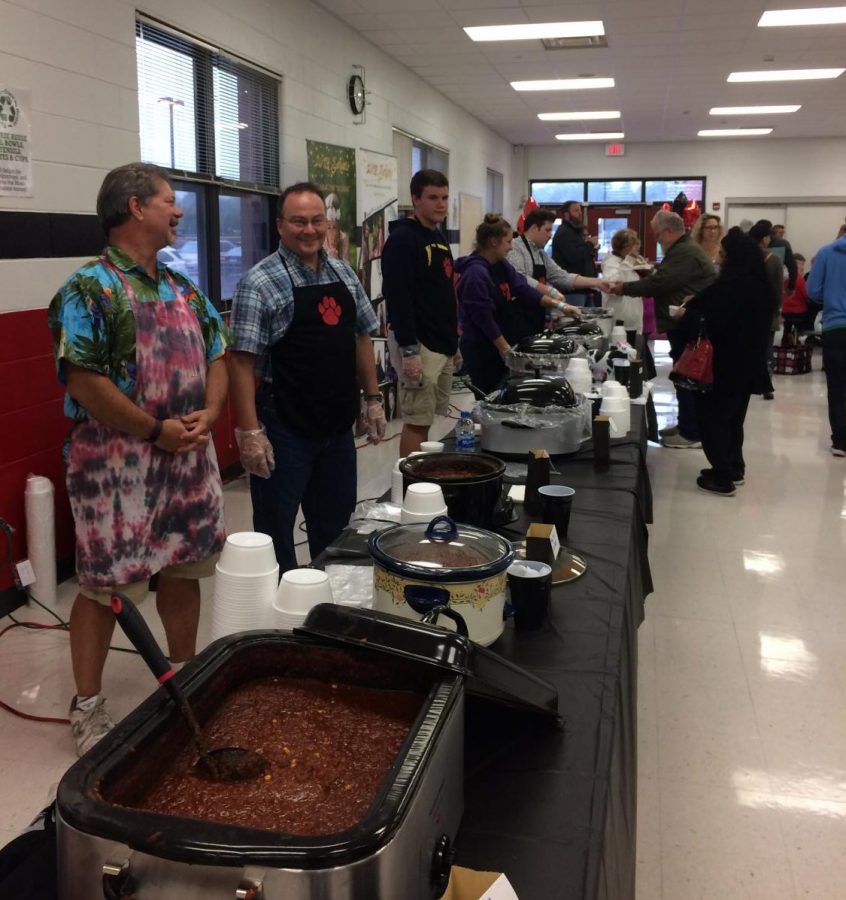 Step right up! Parents and students alike line up their tables for the annual Red Paw Chili Supper. Which Chili was YOUR favorite?