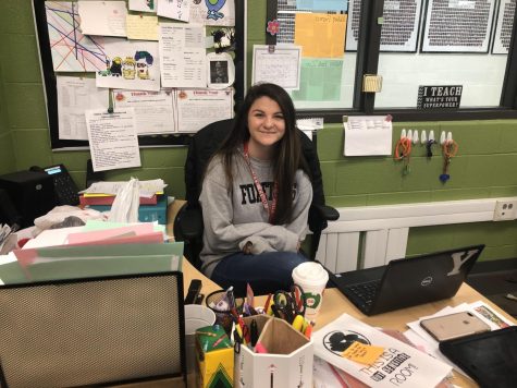 Special education teacher Ms. Corniels gets some work done while her students participate in another class. Corniels is a former YHS graduate who returned here to teach last year.